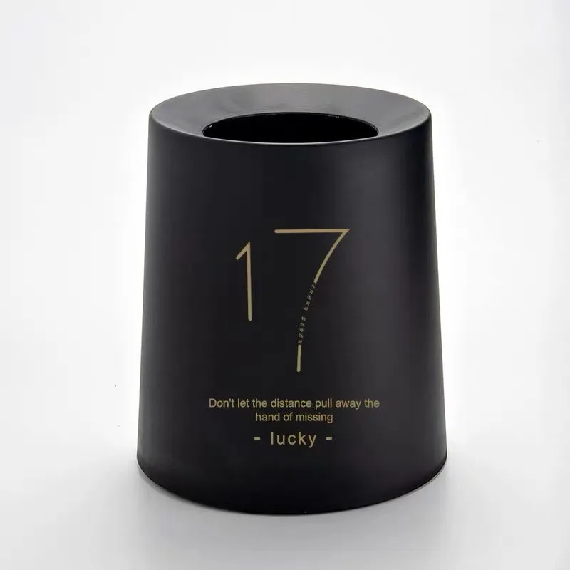 Creative Nordic plastic trash can with decorative pattern in a home setting