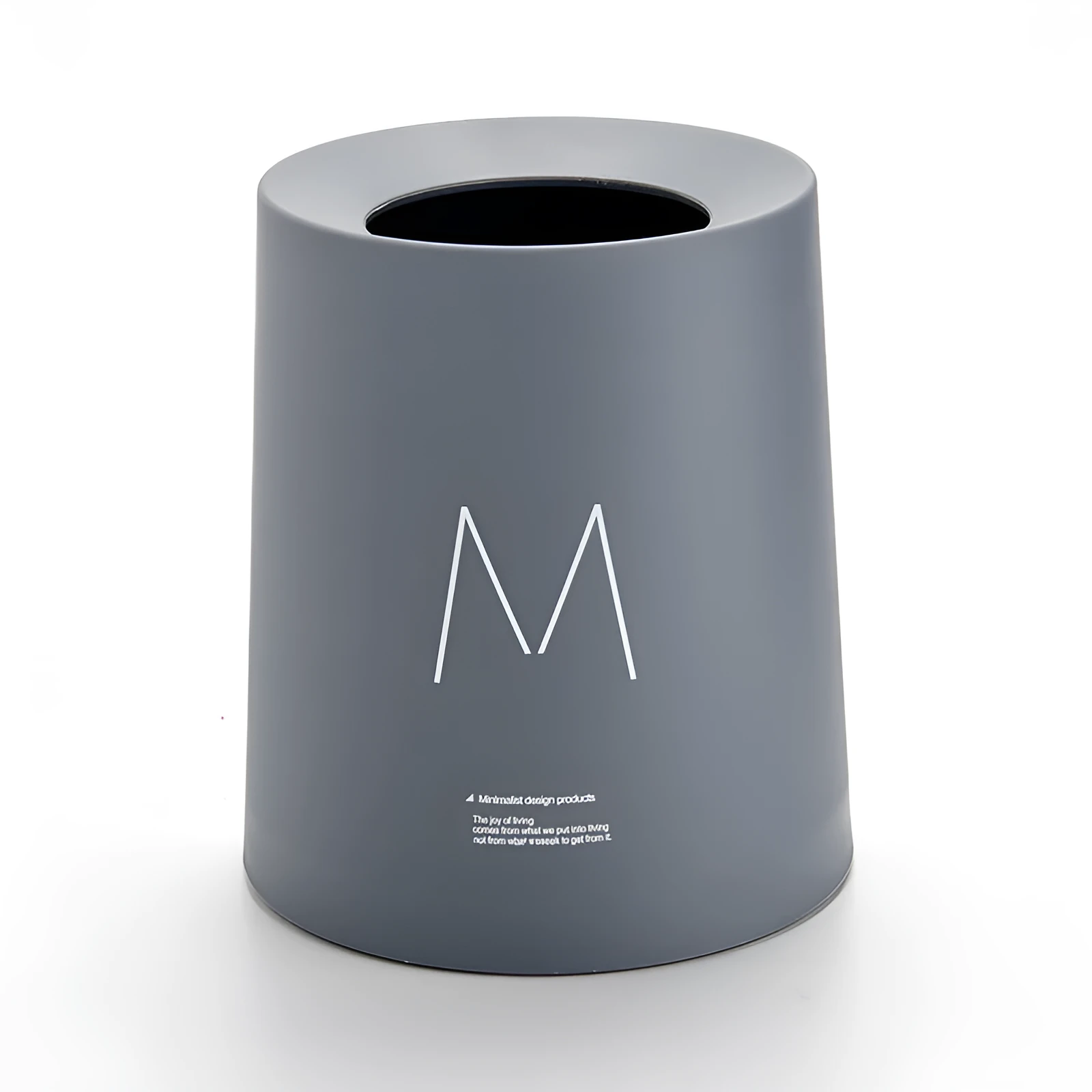 Creative Nordic plastic trash can with decorative pattern in a home setting