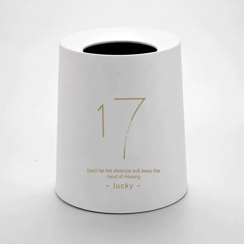 Creative Nordic plastic trash can with decorative pattern in a home setting