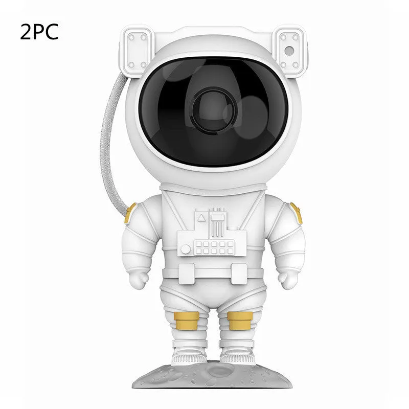 Creative astronaut galaxy starry sky projector nightlight on a table with nebula and star effects displayed against a dark background