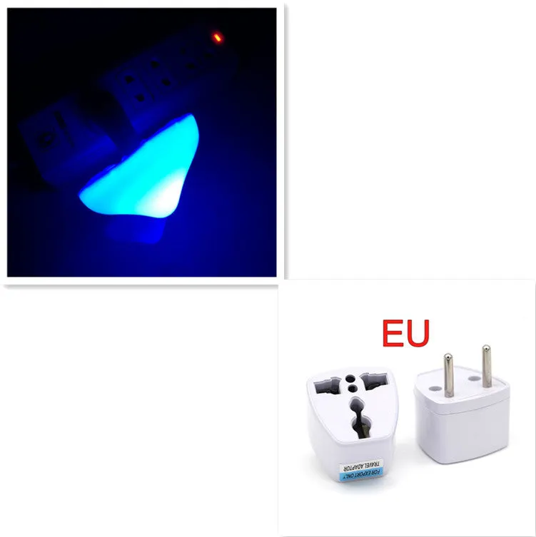 Mushroom-shaped LED night light with light sensor, warm yellow glow, plugging into a wall socket