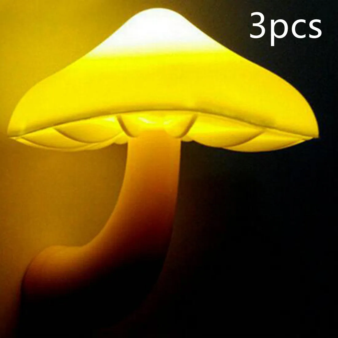 Mushroom-shaped LED night light with light sensor, warm yellow glow, plugging into a wall socket