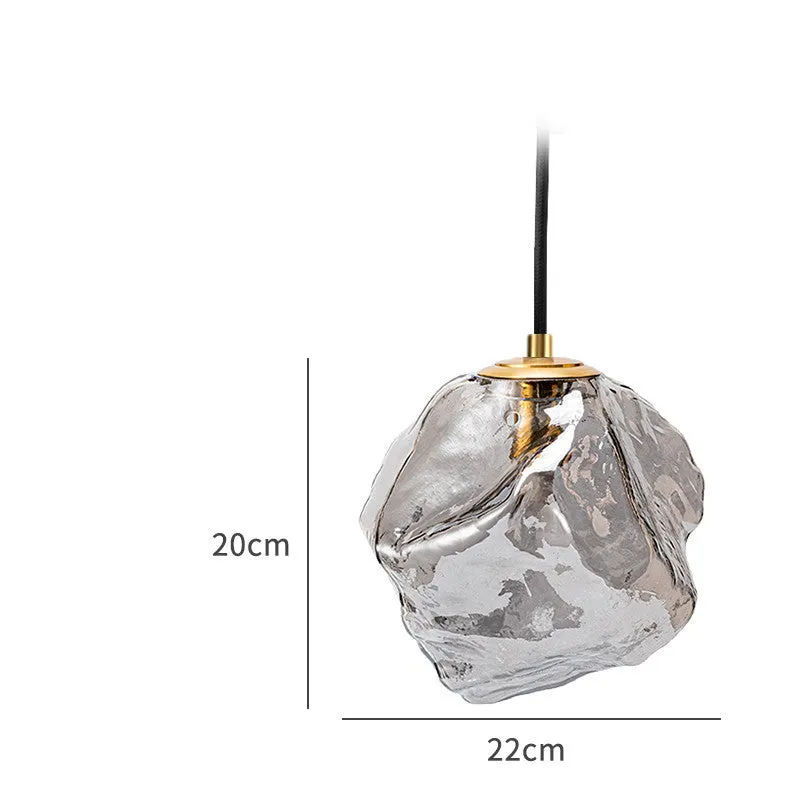 Minimalist ice cube glass chandelier with warm 4000K light, smoky grey shade and black hanging wire over a dining table
