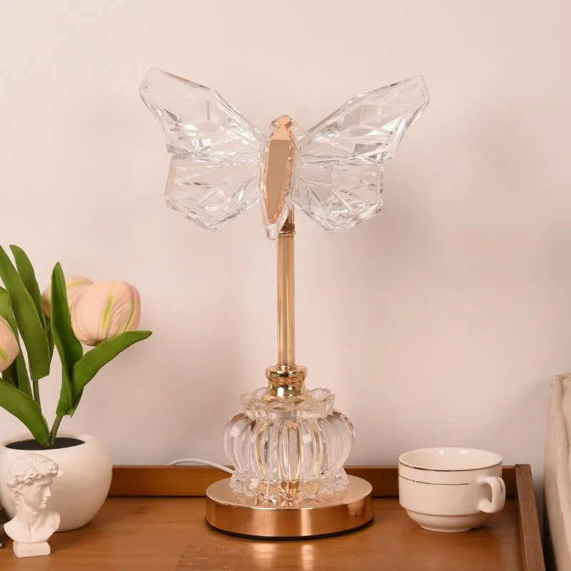 Butterfly table lamp with adjustable brightness and angle in a bedroom setting with USB plug-in