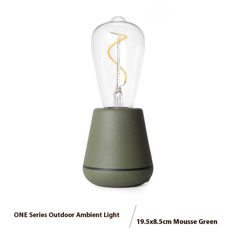 Portable LED camping lantern with aluminium body and 3-speed adjustable brightness in outdoor setting