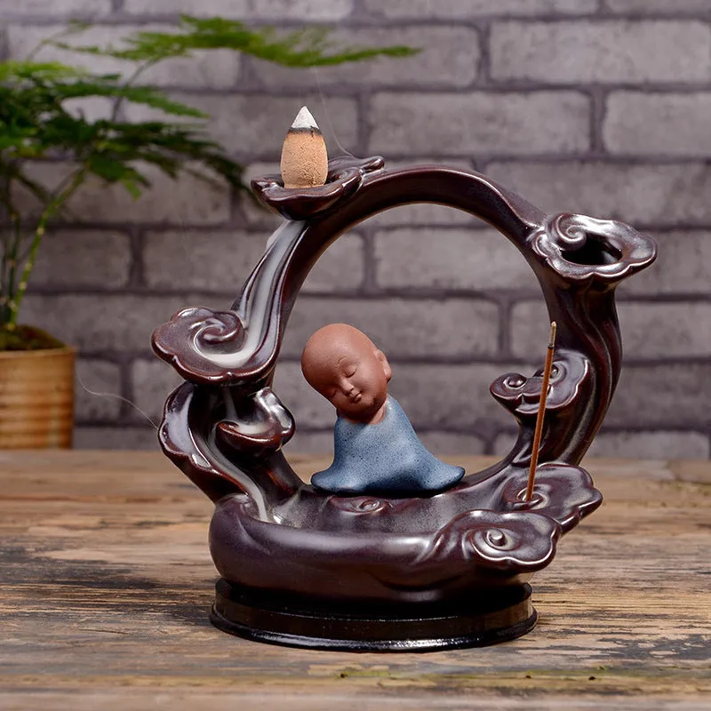 Ceramic backflow incense burner in Zen Lotus Pond Yellow with traditional pottery finish on a wooden table