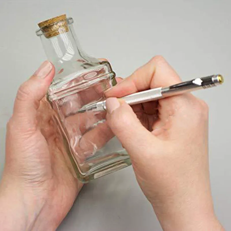 Silver aluminium glass marking pen with tungsten carbide tip on a white background