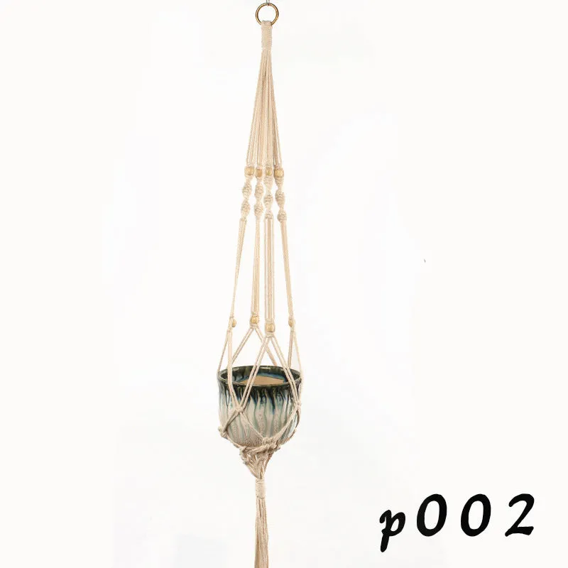 A rustic-style woven cotton rope plant trellis panel supporting green leaves.
