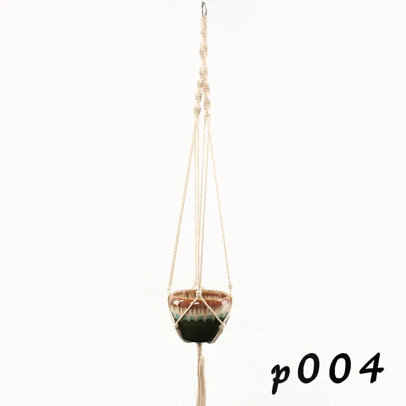 A rustic-style woven cotton rope plant trellis panel supporting green leaves.