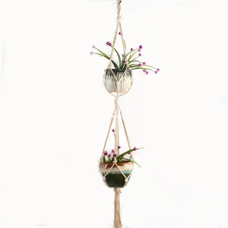 A rustic-style woven cotton rope plant trellis panel supporting green leaves.