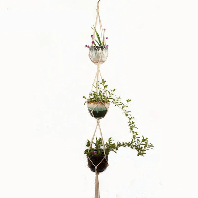 A rustic-style woven cotton rope plant trellis panel supporting green leaves.