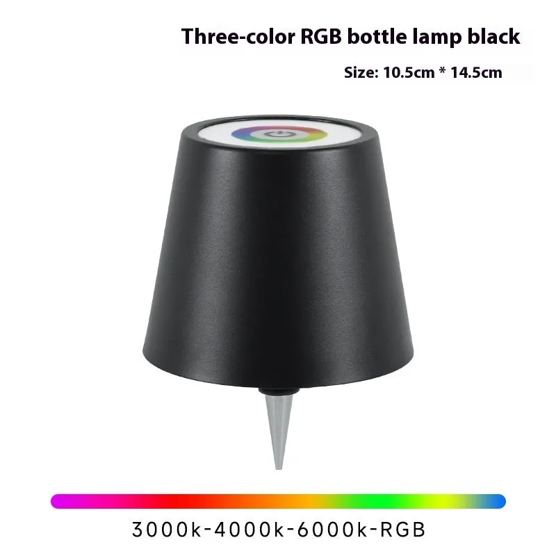 Plug-in wine bottle lamp with RGB tricolour dimming in wrought iron black finish on a table