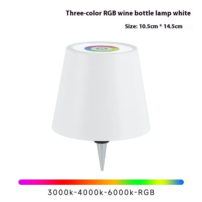 Plug-in wine bottle lamp with RGB tricolour dimming in wrought iron black finish on a table