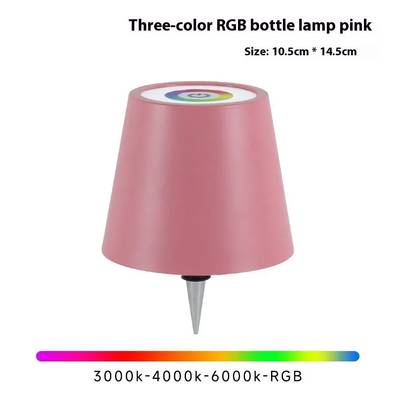Plug-in wine bottle lamp with RGB tricolour dimming in wrought iron black finish on a table