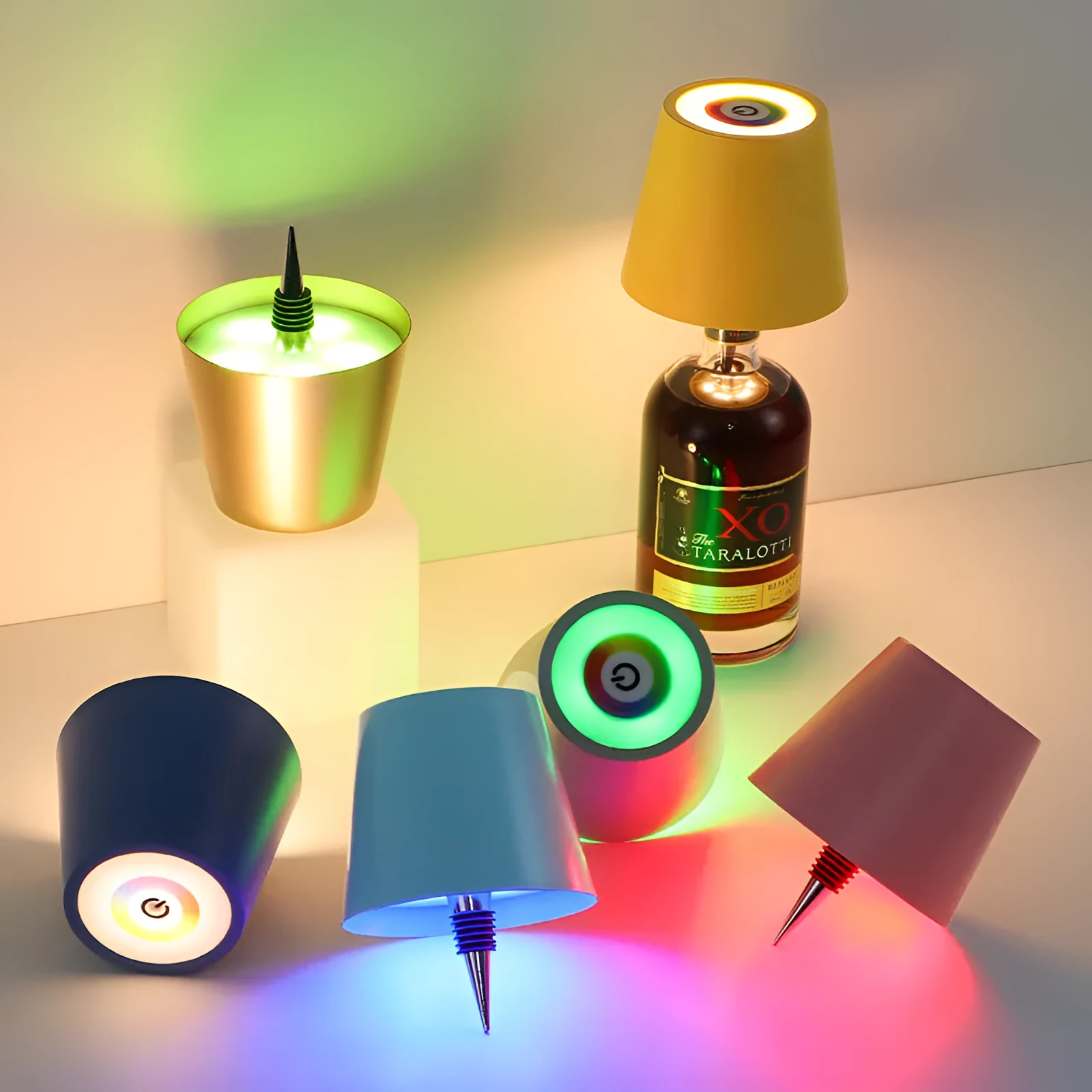 Plug-in wine bottle lamp with RGB tricolour dimming in wrought iron black finish on a table