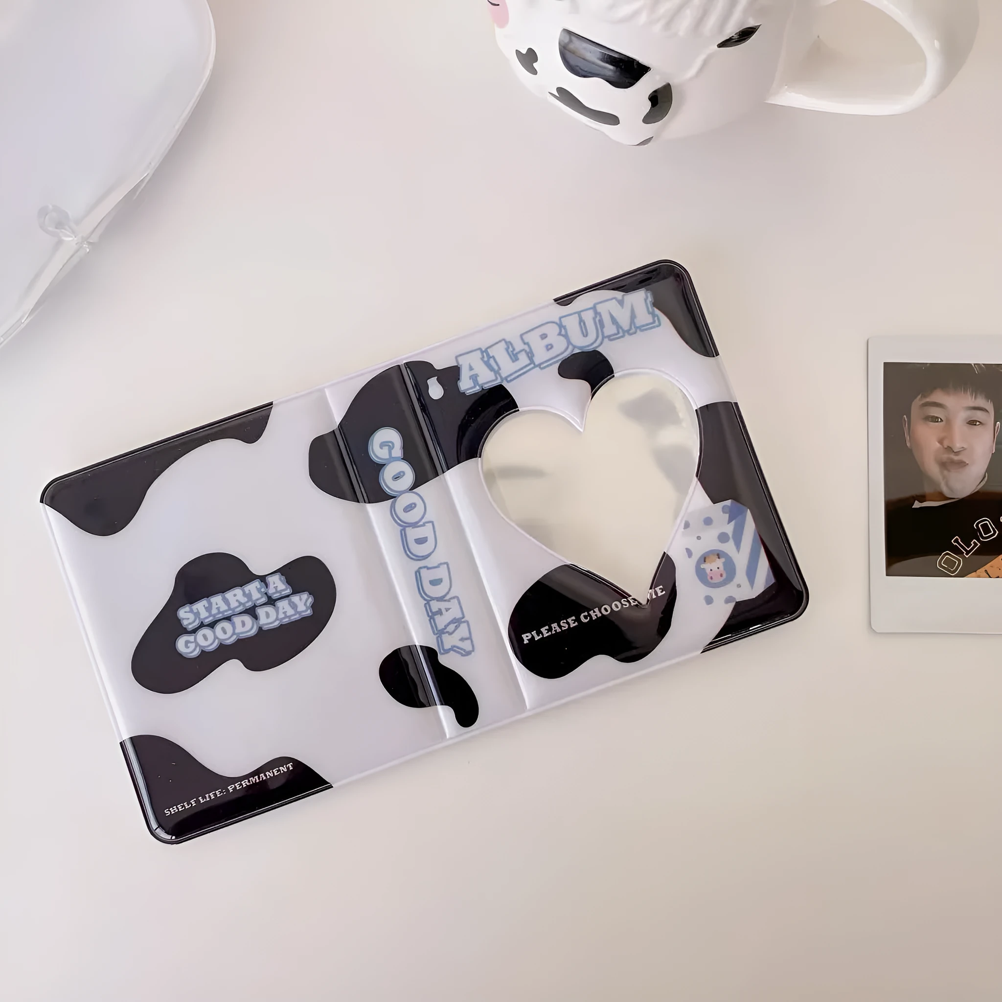 Mini cow PP cover photo album with cartoon cow design holding 64 cards