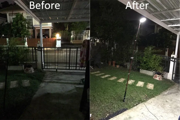 White LED fishing rod light unit on a tall telescopic pole with a remote control for outdoor use.
