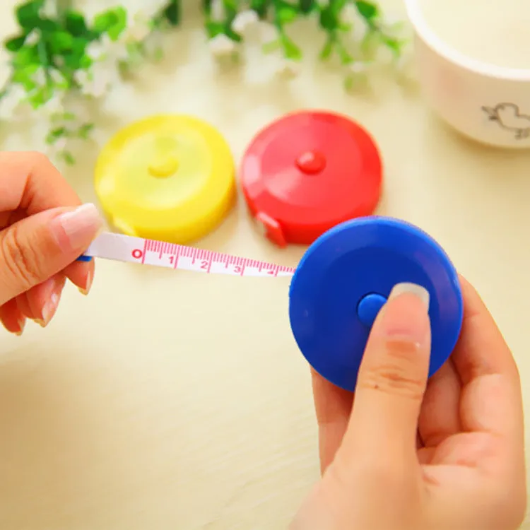 Mini portable plastic measuring tape wound with 150cm metric and city scale, compact 5cm diameter