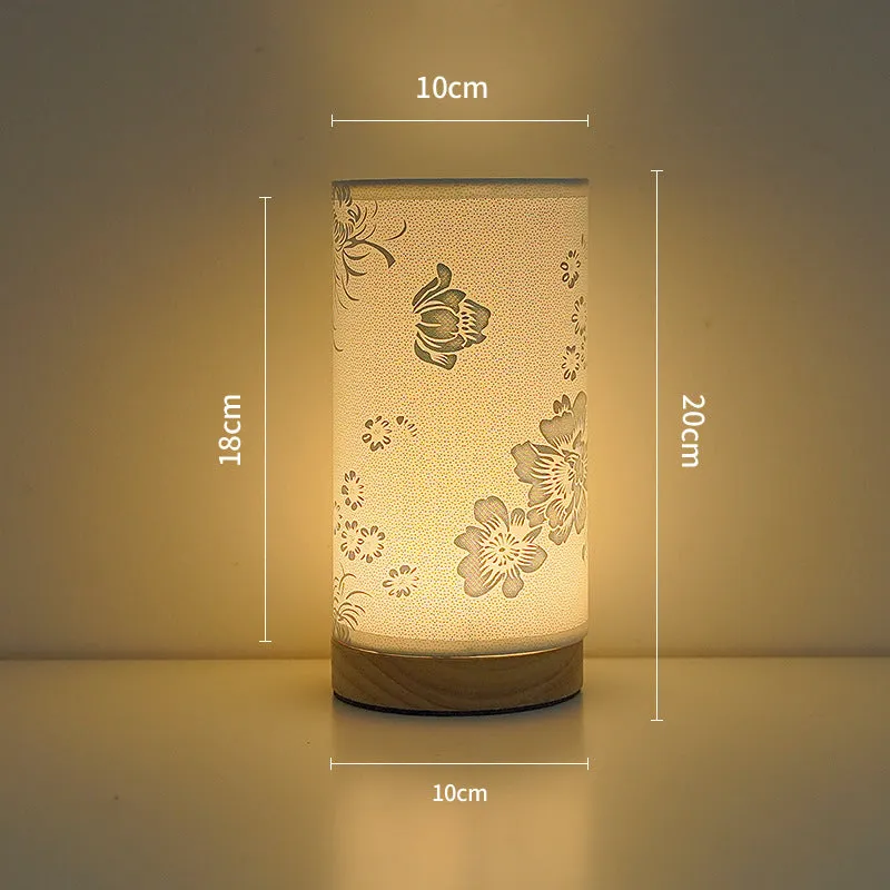 Creative USB table lamp with fabric shade in blue butterfly pattern on modern desk
