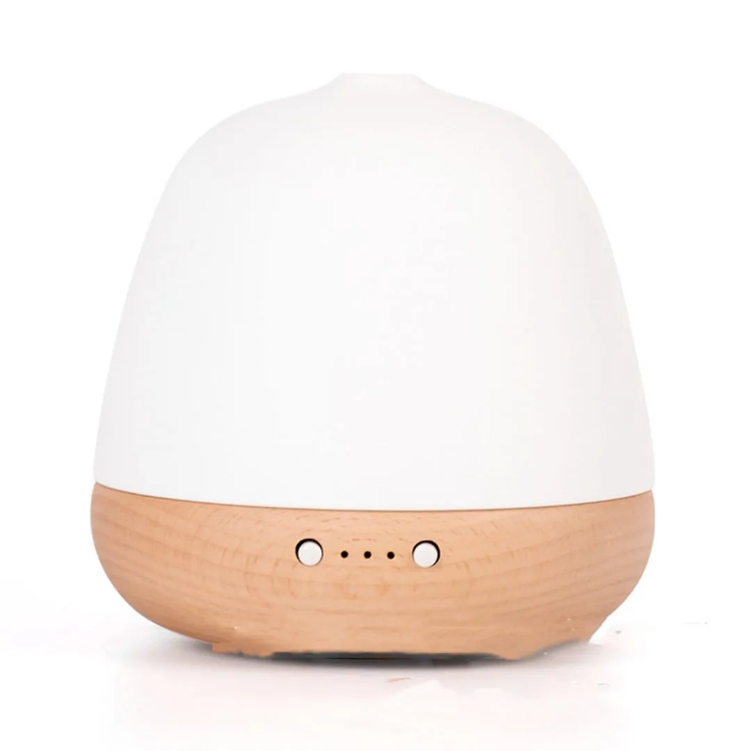 White ceramic ultrasonic essential oil humidifier with 180ml capacity on a table top