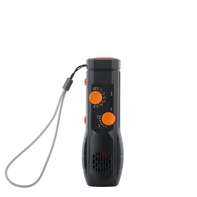 Hand-cranked emergency radio flashlight with USB charging port built-in speaker and manual tuning dial in black