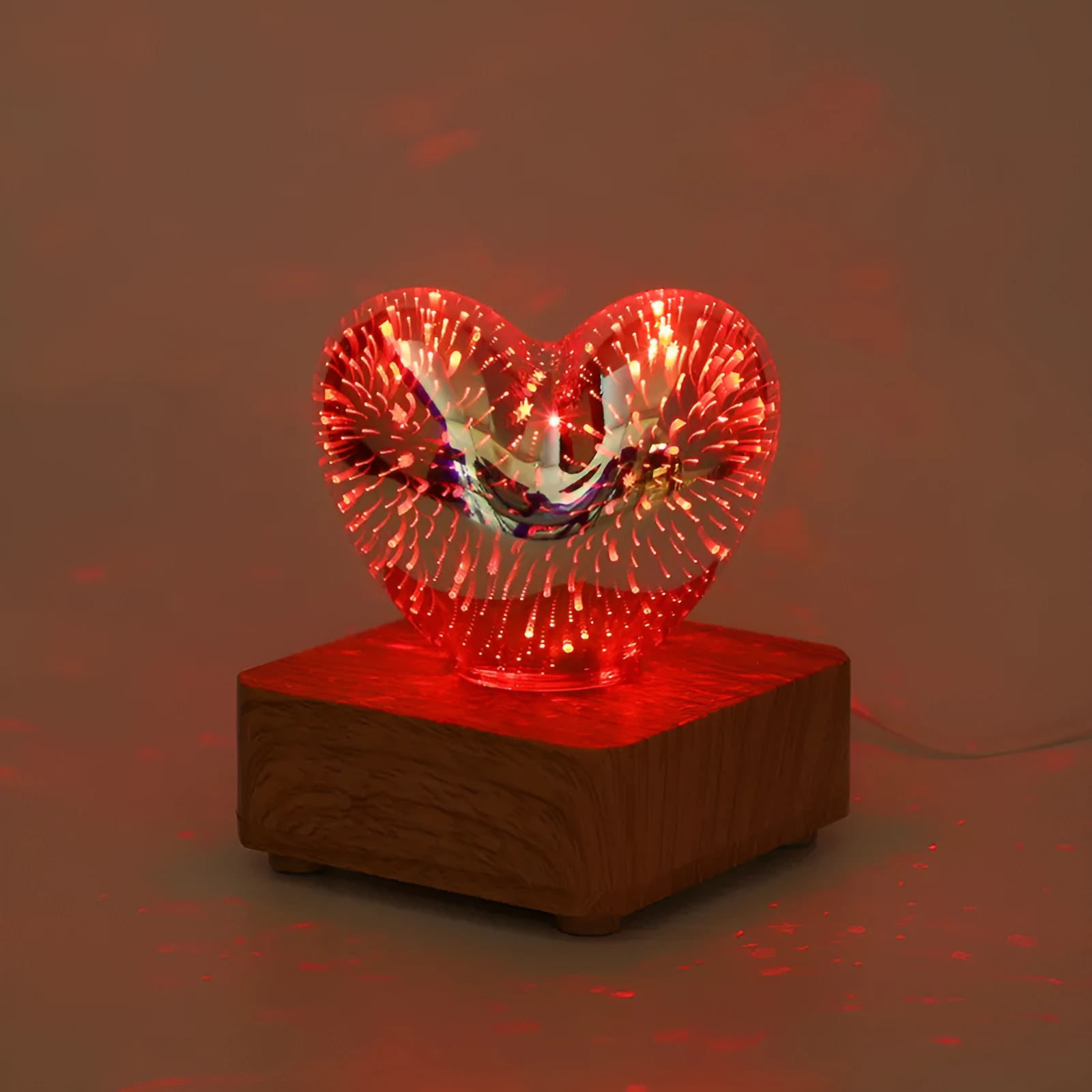 3D love glass small night lamp with silver electroplated finish and solid wood base on a bedside table