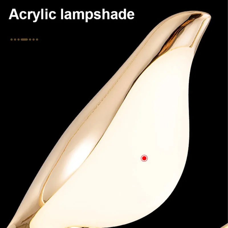 Tall modern magpie bird chandelier in zinc alloy and acrylic with neutral white LED light.