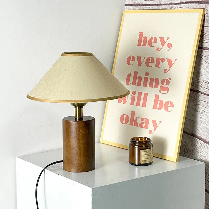 Brown cylindrical wooden bedside lamp with beige cover and E14 bulb base