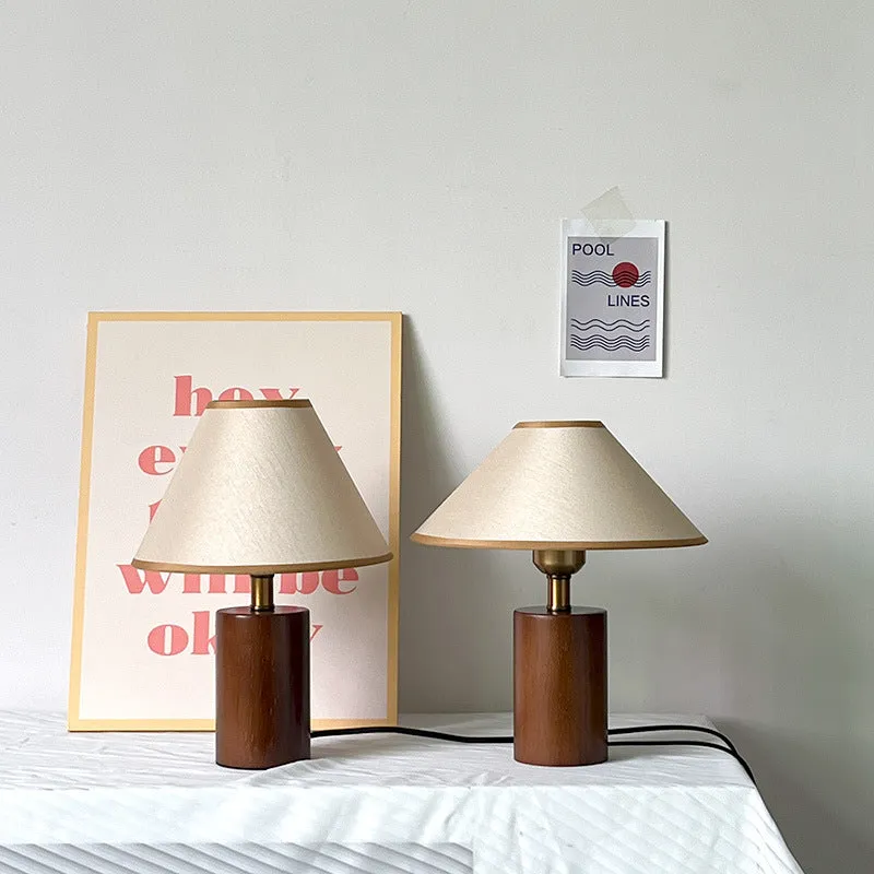 Brown cylindrical wooden bedside lamp with beige cover and E14 bulb base