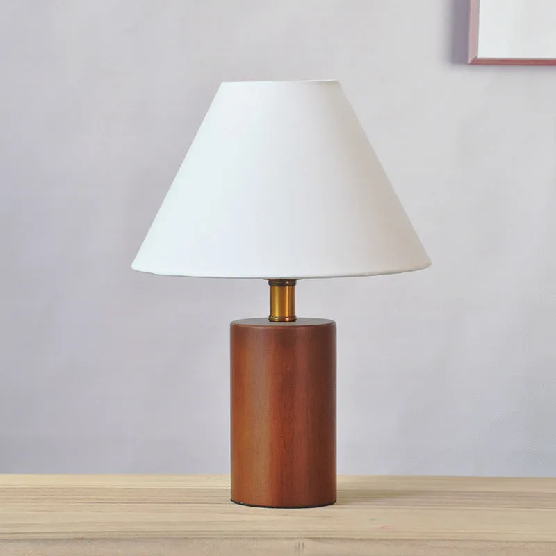 Brown cylindrical wooden bedside lamp with beige cover and E14 bulb base