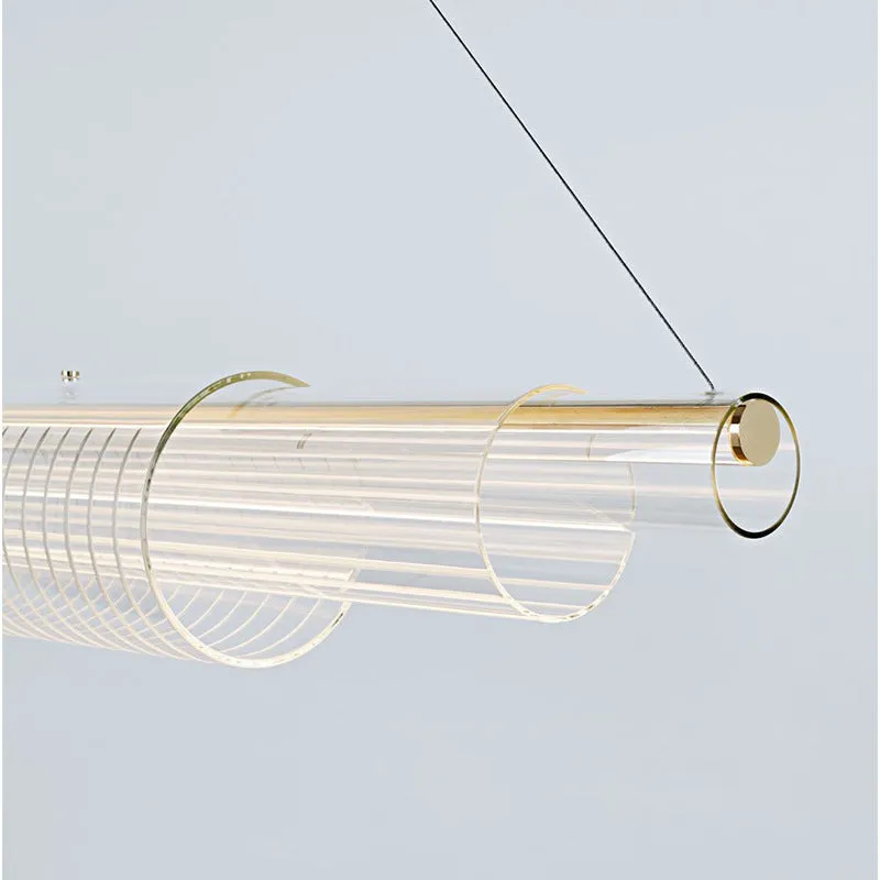 Modern clear glass pendant lamp with iron fittings hanging from a ceiling.