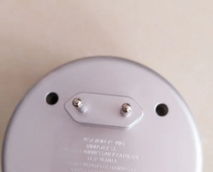 Silver grey intelligent ultrasonic mosquito repellent with compact 10cm size and plug
