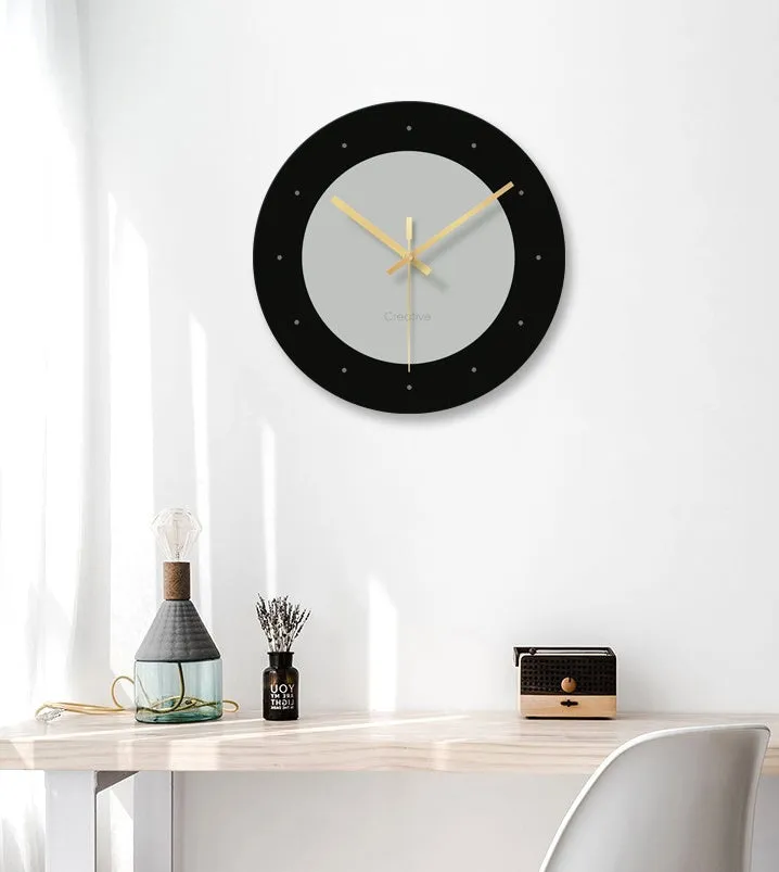 Transparent tempered glass minimalist wall clock with silent movement on a white wall.