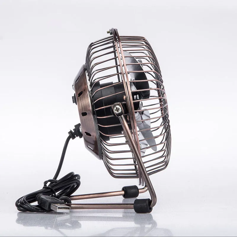 4-inch bronze aluminium USB mini fan with rocker switch on a desk