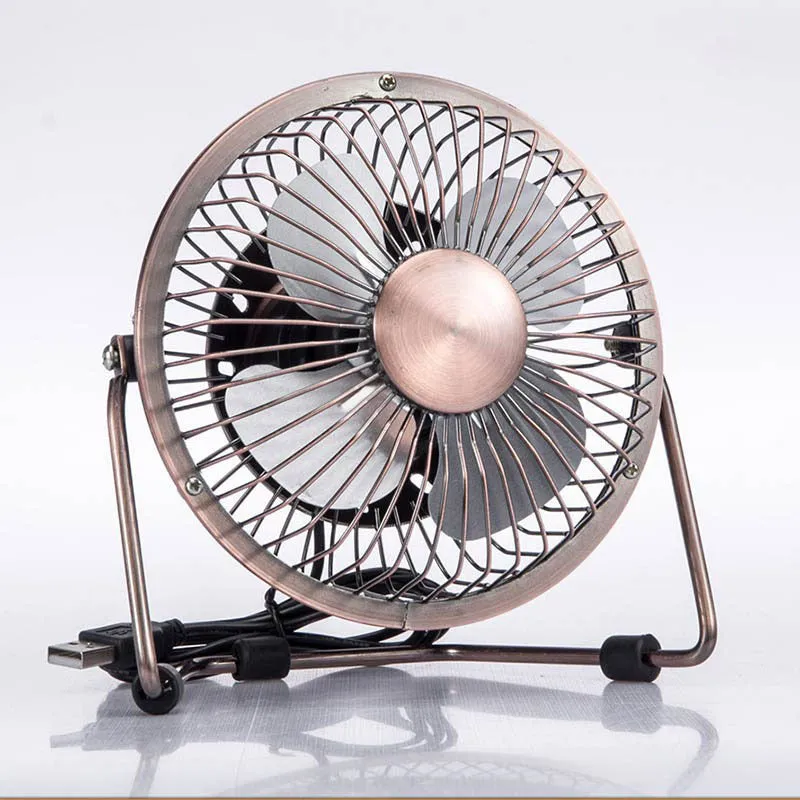 4-inch bronze aluminium USB mini fan with rocker switch on a desk