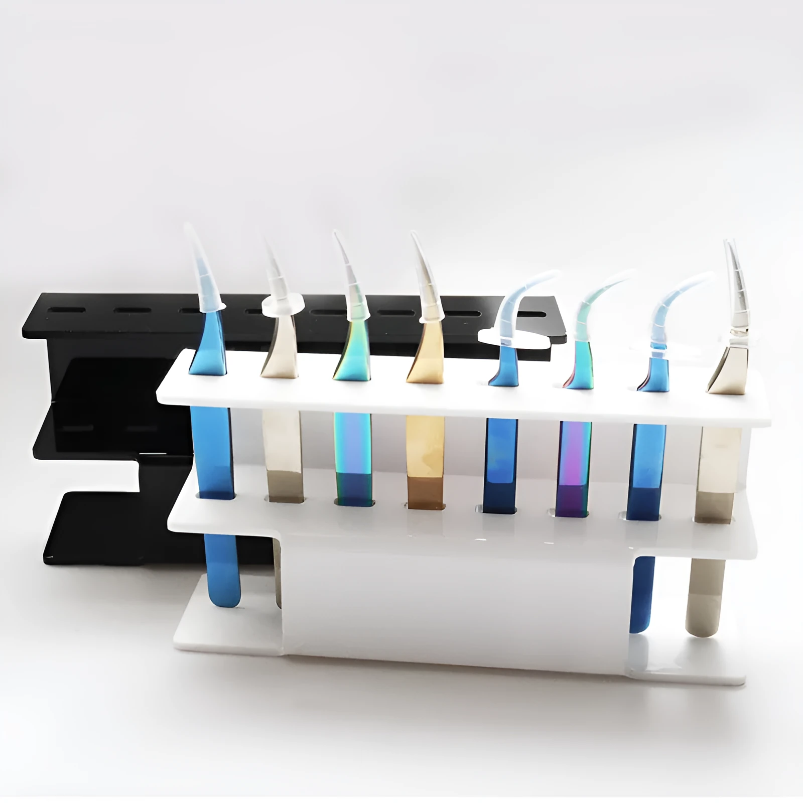 Acrylic tweezers display stand in white finish holding multiple tweezers upright