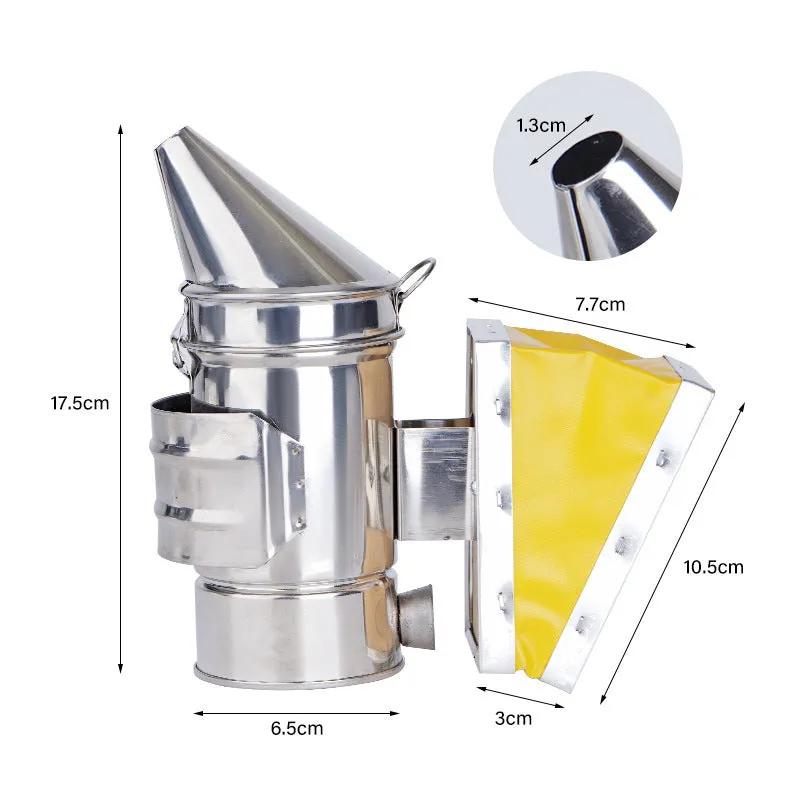 Portable stainless steel beekeeping smoker with leather bellows on a wooden surface