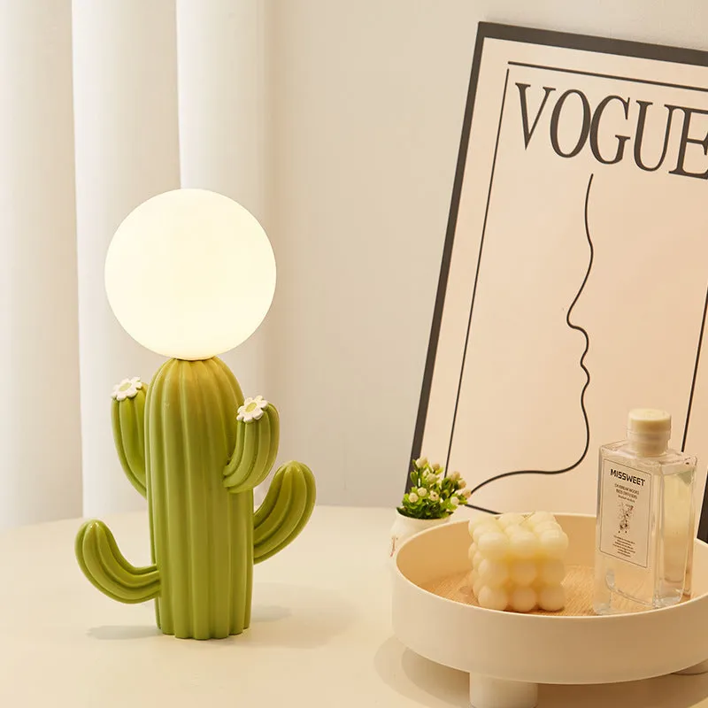 Green cactus button desk lamp with three-colour accents on a bedside table in a child's room