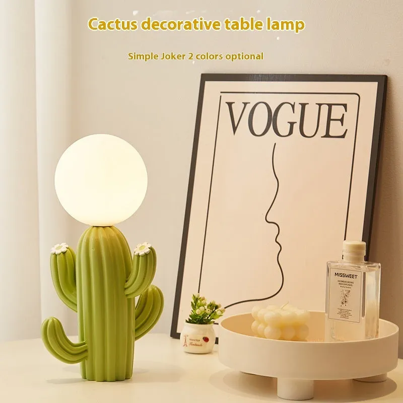 Green cactus button desk lamp with three-colour accents on a bedside table in a child's room
