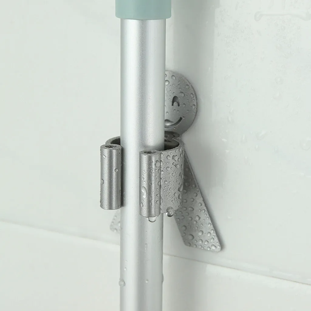 White bathroom toilet mop hook with adhesive backing for wall mounting, holding a toilet brush handle