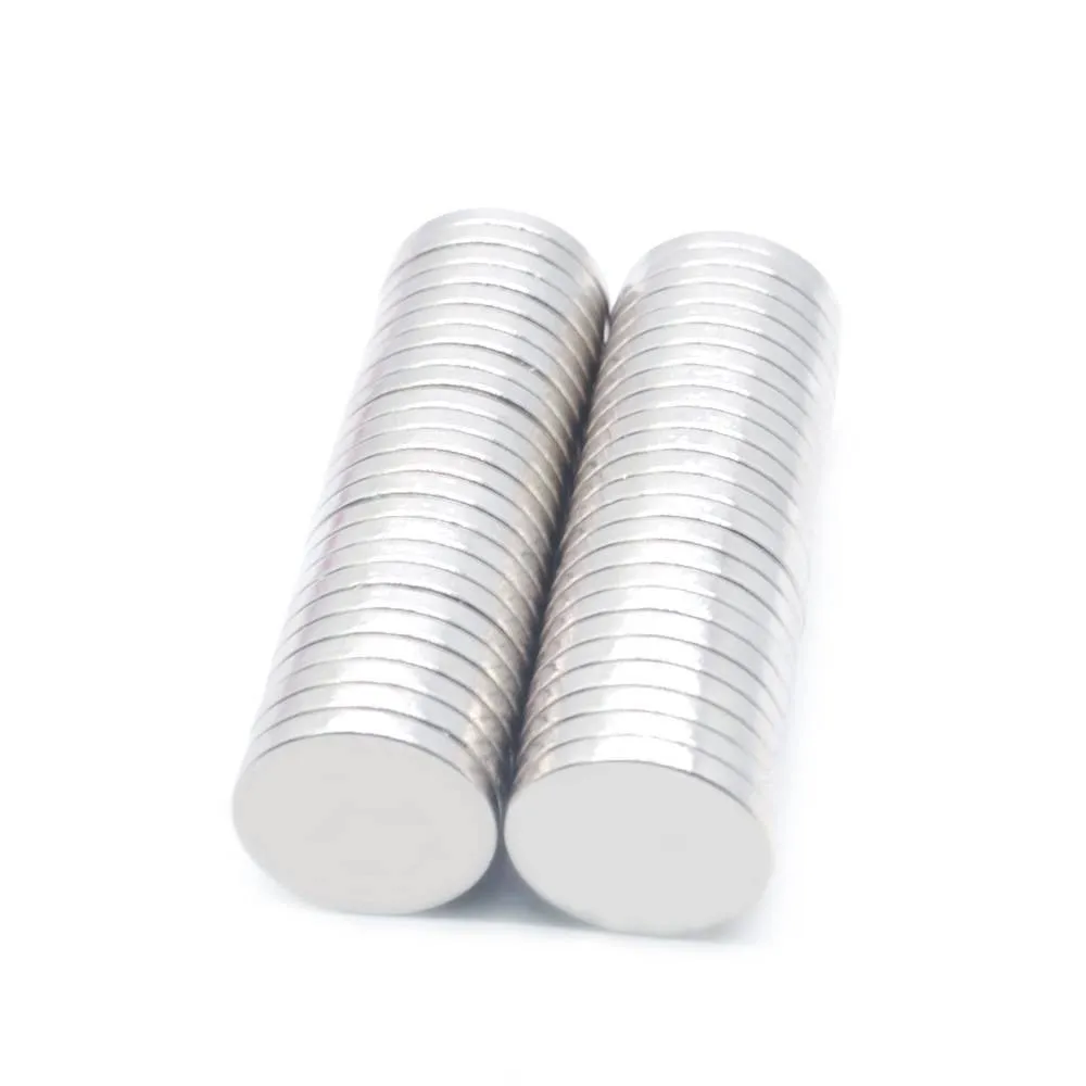 Silver NdFeB disc magnet 14mm diameter 2mm thickness on white background
