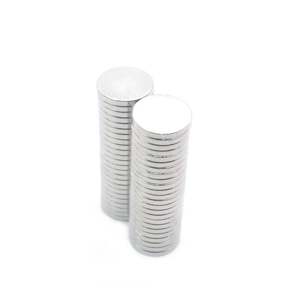 Silver NdFeB disc magnet 14mm diameter 2mm thickness on white background