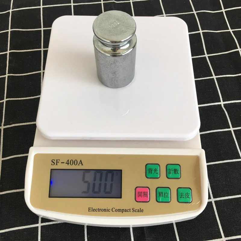 SF-400A model digital electronic kitchen scale on a countertop, showing a digital display.