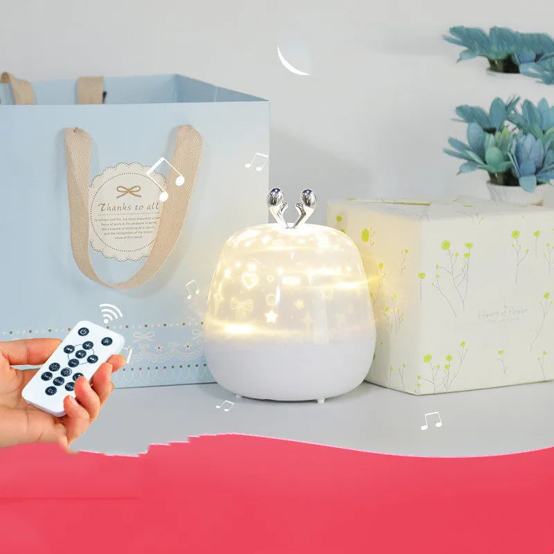 LED starry sky light projector with USB cable and projection film on a tabletop