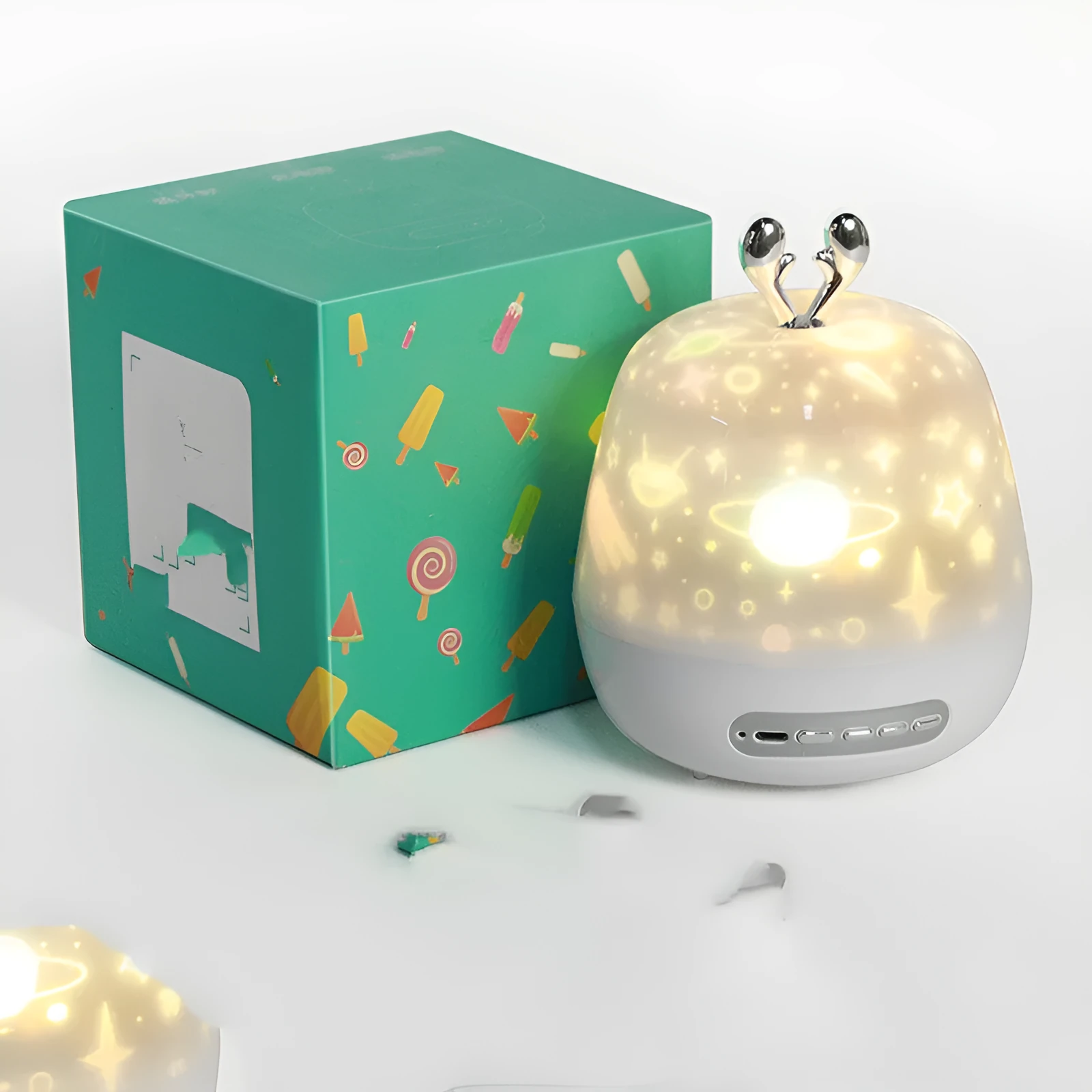 LED starry sky light projector with USB cable and projection film on a tabletop