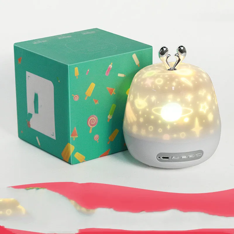 LED starry sky light projector with USB cable and projection film on a tabletop