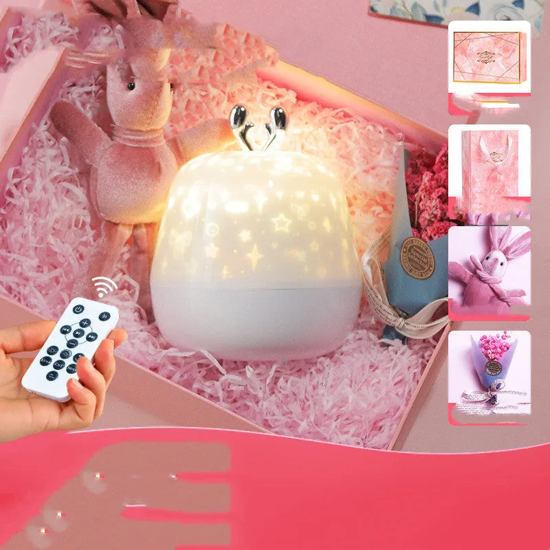 LED starry sky light projector with USB cable and projection film on a tabletop