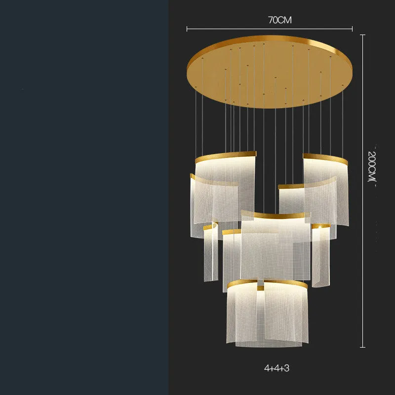 Large gold mesh disc chandelier with multiple pendant heads against a light ceiling