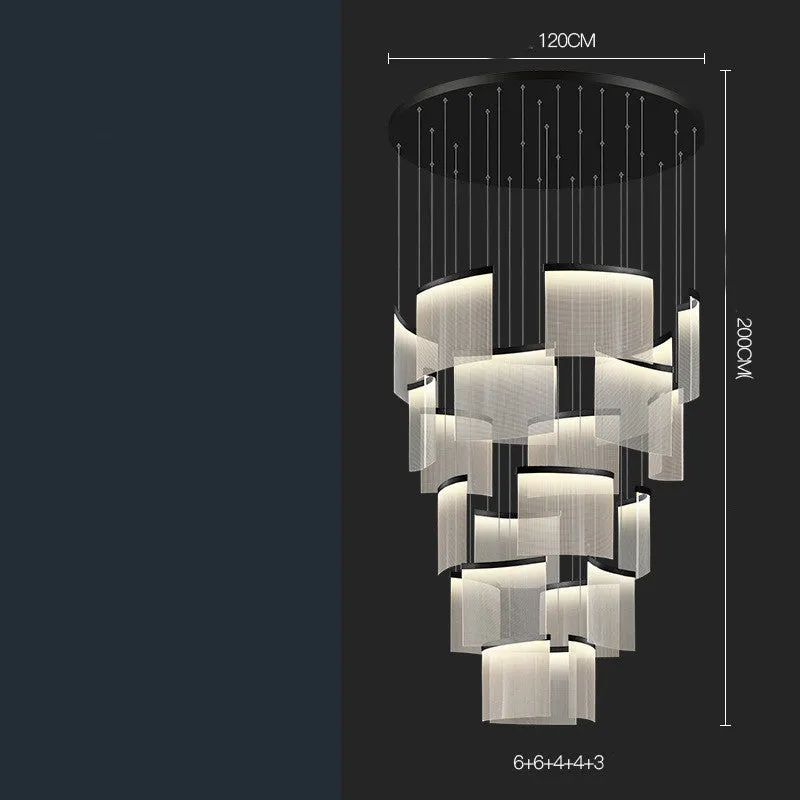 Large gold mesh disc chandelier with multiple pendant heads against a light ceiling