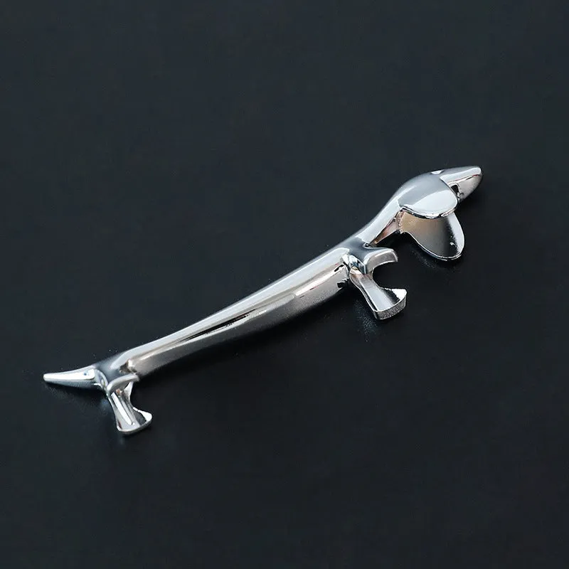 Silver zinc alloy sausage dog chopstick rest knife holder on desk with pen and chopsticks